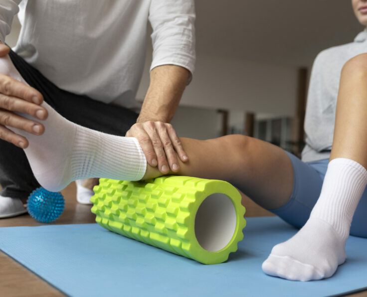 patient-doing-physical-rehabilitation-helped-by-therapists